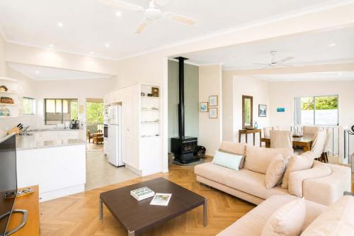 a living room with a couch and a table at Dream Weaver in Bawley Point