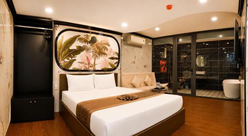 a bedroom with a large white bed in a room at Red Sun Airport Saigon Hotel in Ho Chi Minh City