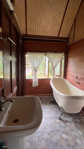 a large bathroom with a tub and a sink at Elephant House and Pool Villas in Ban Sop Ao
