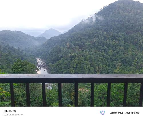 a view of a valley with a river and mountains at Adventure Manor in Kitulgala