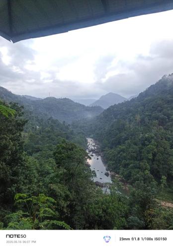 a view of a river in the middle of a valley at Adventure Manor in Kitulgala