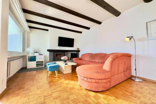 a living room with a couch and a tv at On the Lake 2BR with Garage in Porto Ronco - Happy Rentals in Ronco sopra Ascona