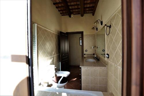 a bathroom with a tub and a sink and a toilet at Villa Escutia in Cazalla de la Sierra