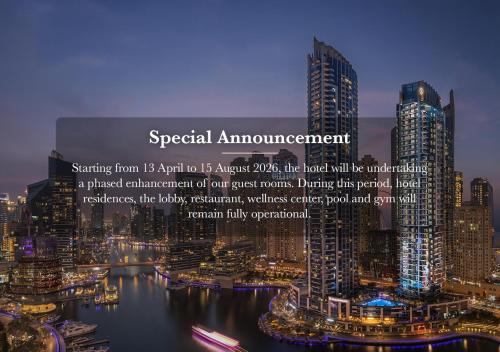 a view of a city at night with lights at InterContinental Dubai Marina by IHG in Dubai