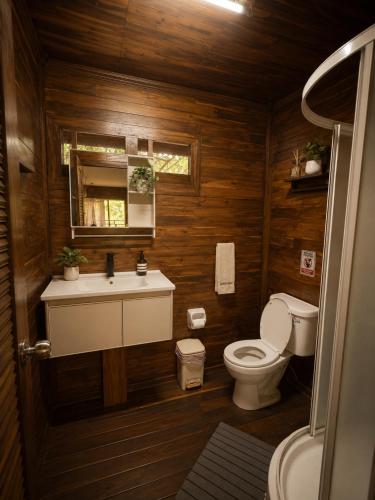 a bathroom with a toilet and a sink at Hidden Home Samui in Koh Samui