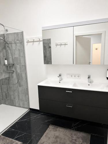 a bathroom with a sink and a mirror at Maria Blick in Maria Wörth