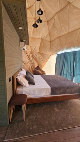 a bedroom with a bed in a tent at Glamping Yeghegis in Yeghegis