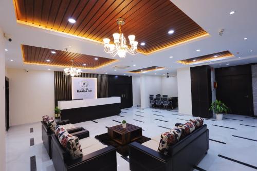 a conference room with chairs and a table and a podium at Hotel RAAGA INN in Tirupati