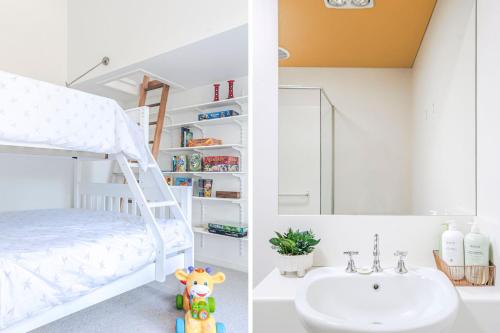 a bedroom with a bunk bed and a sink at Aria House in Trentham