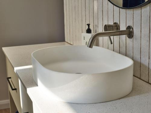 a white sink sitting on a counter in a bathroom at Glenbosch - Cottage One in Beechworth