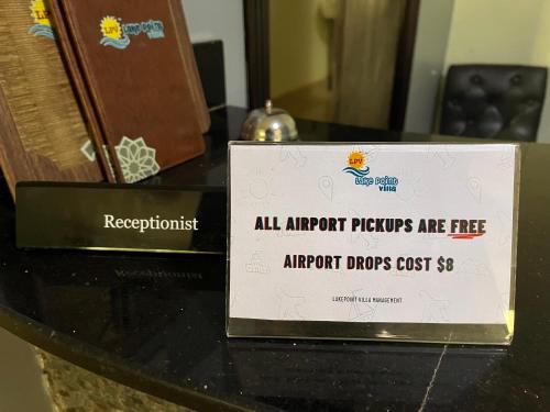 a sign sitting on top of a table at Lakepoint Villa in Entebbe