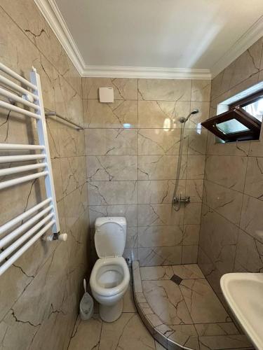 a bathroom with a toilet and a sink at Guest House - Avlabari in Tbilisi City