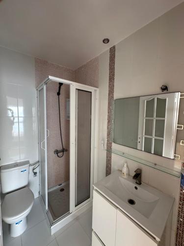 a bathroom with a toilet and a sink and a shower at Sensia Mediterranean Escape in Aouchtame