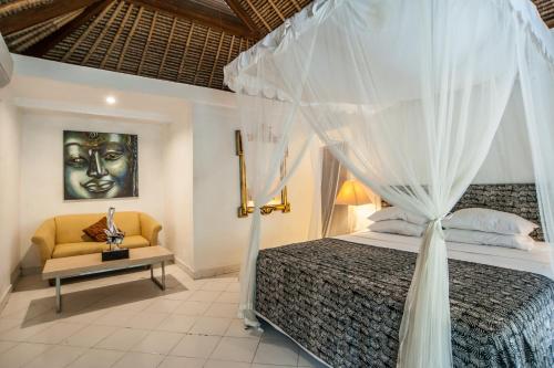 Postel nebo postele na pokoji v ubytování Bali Mystique Hotel & Apartment