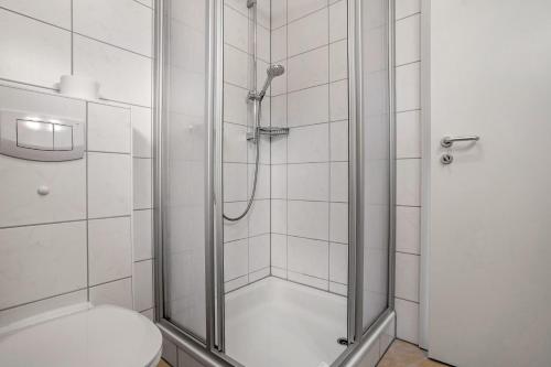 a bathroom with a shower with a toilet at Haus 44 in Röbel