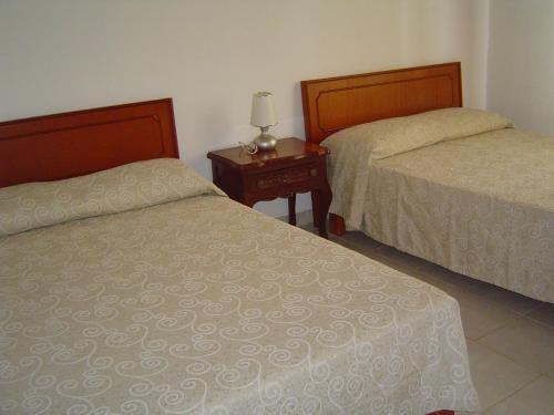 Una cama o camas en una habitación de Villas del monteón