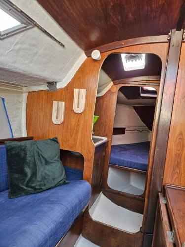 a small room with a bed in the back of a van at BoatMotel in Sainte-Marie-la-Mer