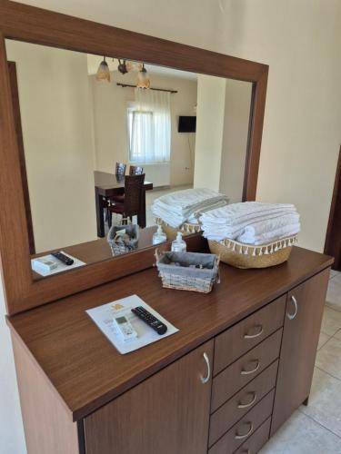 a dresser with a mirror on top of it at Villa Aggelos in Skala Sotiros