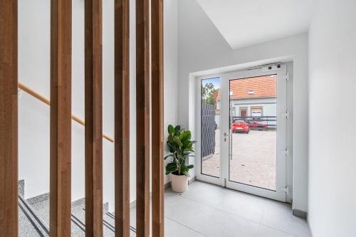 a hallway with a door leading to a garage at Haus Seeluft - W5 in Butjadingen