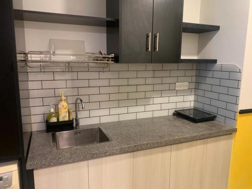 a kitchen with a sink and a counter top at NAYO Cam Ranh - Beachfront Residence in Cam Ranh International Airport