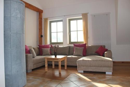 a living room with a couch and a table at Haus Maja in Kurort Rathen