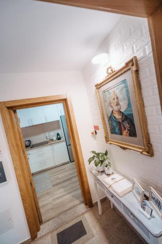 a room with a painting of a man on the wall at Houses São Pedro in São João da Pesqueira