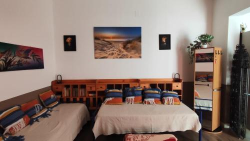 a bedroom with two beds with pillows on them at Salentino in Lequile