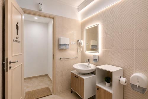 a white bathroom with a sink and a mirror at Rooms4you 2 in historic center of Braga in Braga