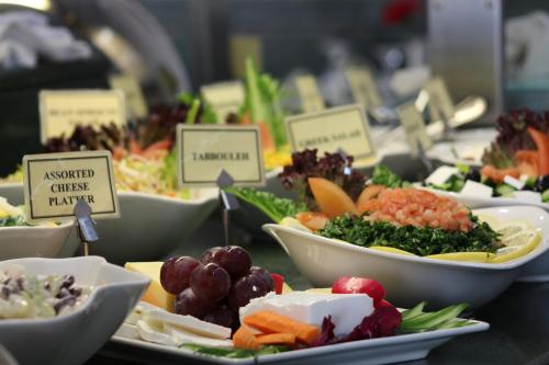 a bunch of plates of food on a table at Al Diar Dana Hotel in Abu Dhabi
