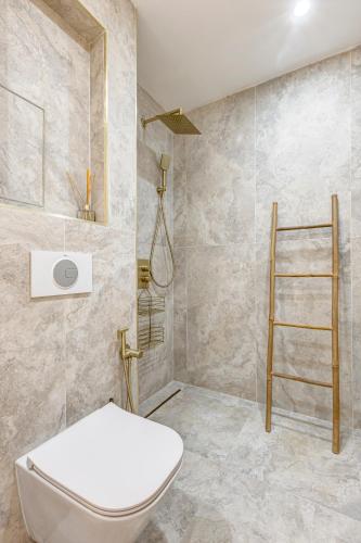 a bathroom with a toilet and a shower at Dalia Residence - Boutique Apartment in Sofia