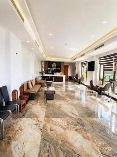 a large living room with couches and a table at Nhật Lệ River Hotel Quảng Bình in Huân Cát