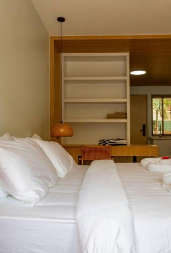 a bedroom with two beds with white pillows at Wing 4203 - Modern Resort Studio Koh Samui in Bophut