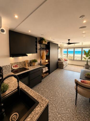Vue mer Studio design neuf Plage & Parking