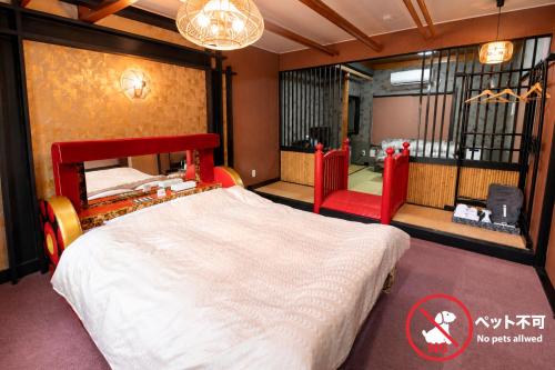 a bedroom with a large bed in a room at ホテルサルビア in Tendo