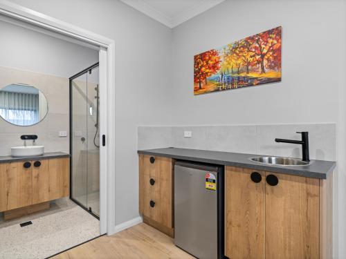 a bathroom with a sink and a shower at Central Studio in new townhouse in Beechworth