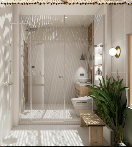 a bathroom with a glass shower with a toilet at Samui Honey Cottages Beach Resort - SHA Extra Plus in Choeng Mon Beach
