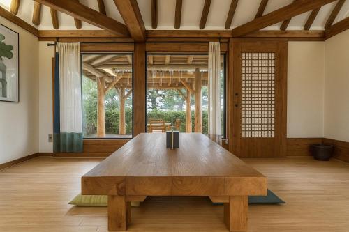 a wooden table in the middle of a room at The Seaes Hotel & Resort in Seogwipo