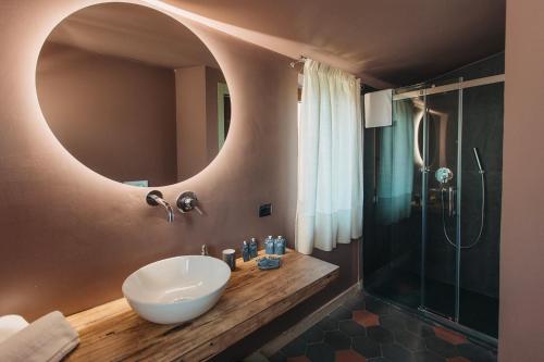a bathroom with a sink and a mirror at VILLA SUMAC 6, Emma Villas in Sortino