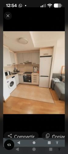 a small kitchen with a stove and a refrigerator at IM80 in Montroig