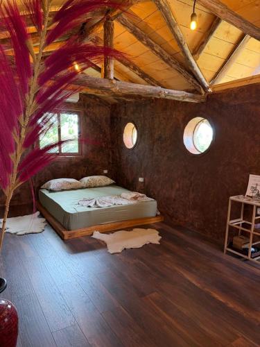 a bedroom with a bed in the middle of a room at Astoha in Durrës