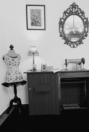 a dress on a mannequin in a room with a mirror at Cal Jan HUT6-8208 in Aixovall