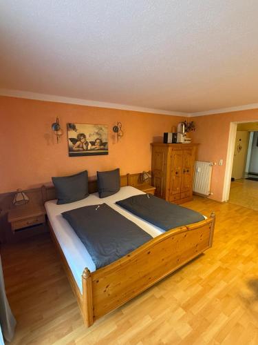 a bedroom with a large bed in a room at Haus Hönigsgrub in Rinchnach