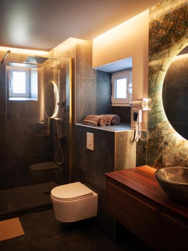 a bathroom with a toilet and a sink at Galaxy Mood - 10 min Disney in Couilly-Pont-aux-Dames