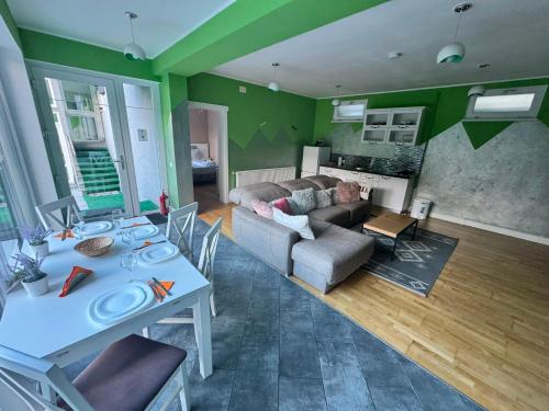 a living room with a table and a couch at Premont Bran GuestHouse in Bran