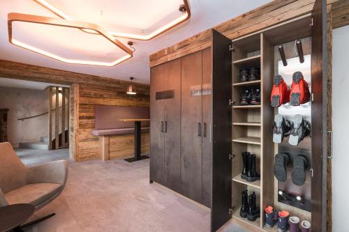 a room with a closet with shoes in it at Ferienparadies Taxen in Sankt Veit im Pongau