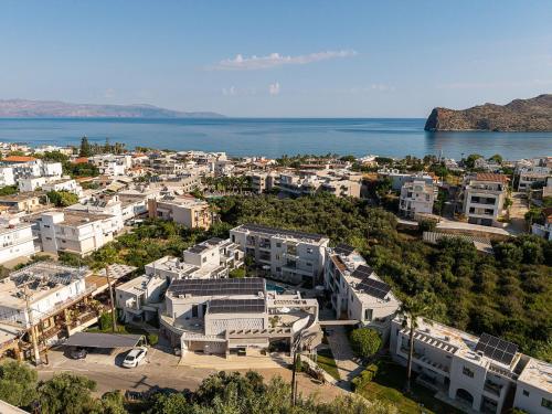 an aerial view of a city next to the water at Minos Village in Agia Marina Nea Kydonias