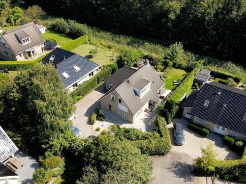 an aerial view of a house with solar panels at The Poplar Place - Spacious Comfort, Hot Tub in Private Garden in Zeewolde