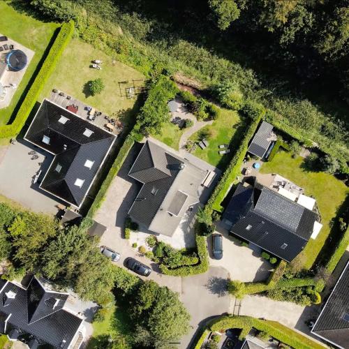 an overhead view of a group of houses at The Poplar Place - Spacious Comfort, Hot Tub in Private Garden in Zeewolde