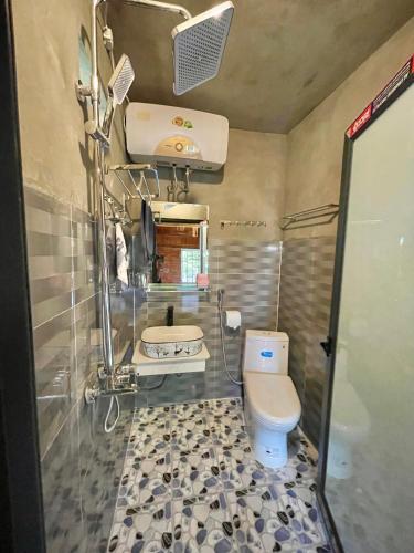a bathroom with a toilet and a sink at Red Dao Homestay and Entire bungalow in Tả Van