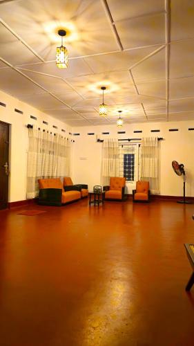 a large living room with couches and a table at Samson & Ruby Villa in Weligama
